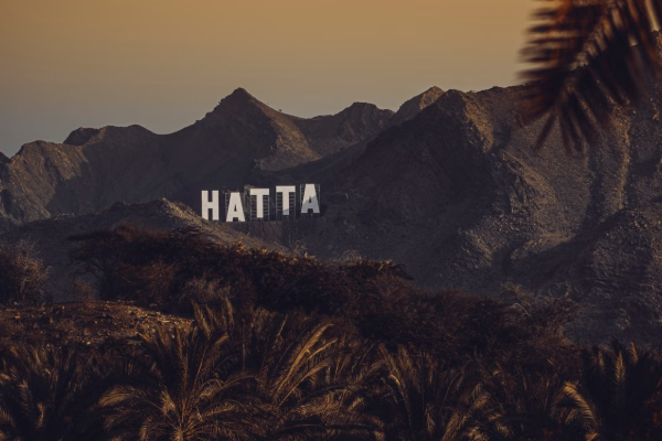 Stunning view of Hatta mountains with signage at sunset, United Arab Emirates