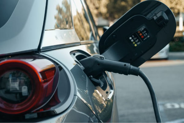 Electric vehicle being charged, highlighting modern clean energy technology