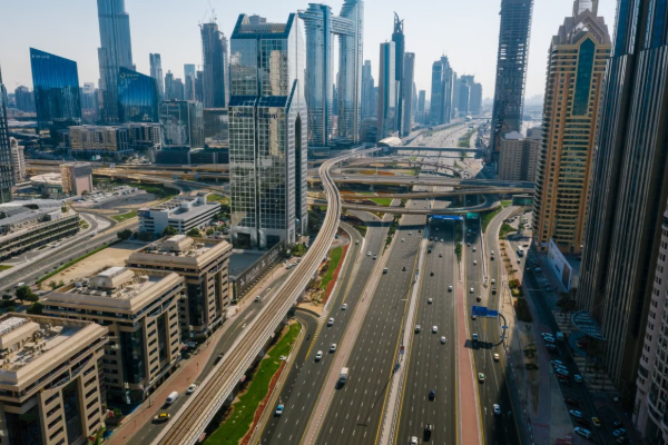 Aerial view capturing the dynamic skyline and highways of Dubai, UAE